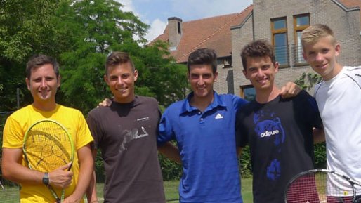 Older teenage players with their tennis coach